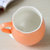 敏杨 色釉布袋杯单只装 赠白瓷小汤匙 家用陶瓷杯子 牛奶杯 咖啡杯 办公用杯 学生牛奶杯(橙色)第3张高清大图