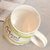 豪峰 创意马克杯陶瓷杯咖啡杯早餐杯牛奶杯卡通可爱水杯带盖勺(【绿色】【条纹奶牛杯】【配盖勺】)第4张高清大图