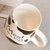 豪峰 创意马克杯陶瓷杯咖啡杯早餐杯牛奶杯卡通可爱水杯带盖勺(【黑色】【大斑点奶牛杯】【配盖勺】)第4张高清大图