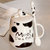 豪峰 创意马克杯陶瓷杯咖啡杯早餐杯牛奶杯卡通可爱水杯带盖勺(【黑色】【大斑点奶牛杯】【配盖勺】)第2张高清大图