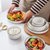日式饭碗单个碗碟套装家用创意个性汤碗网红餐具碗陶瓷鱼盘子组合(4.5英寸碗*10+勺子*10)第4张高清大图