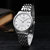 天梭(TISSOT)手表力洛克系列 T006新款80小时全自动机械时尚潮流精男表(银壳白面银钢带)第4张高清大图